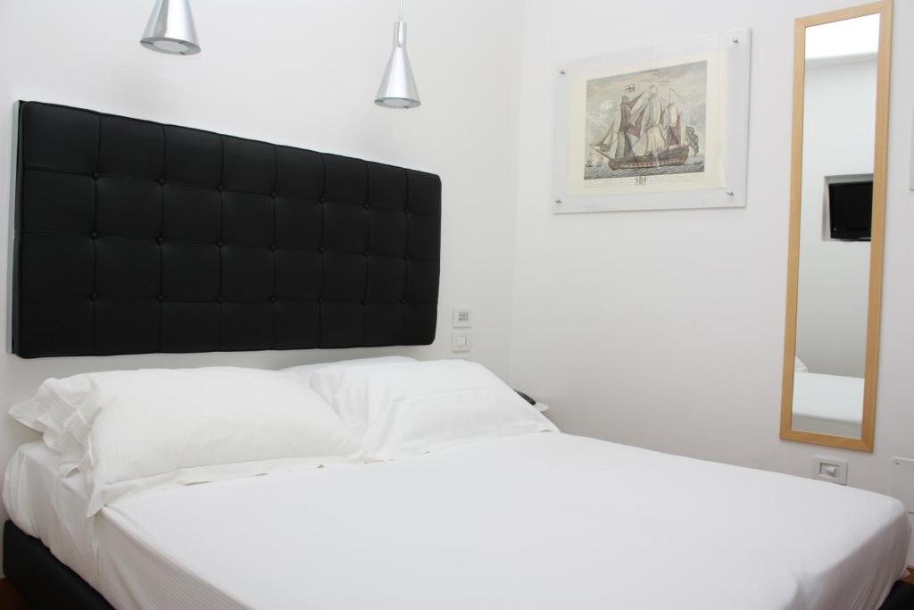 Postel nebo postele na pokoji v ubytování Hotel Del Conte