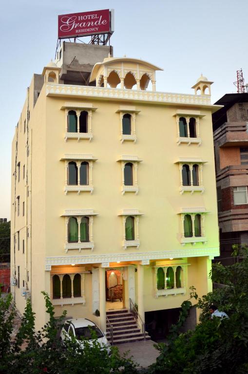 a building with a sign on top of it at Hotel Grande Residency in Jaipur