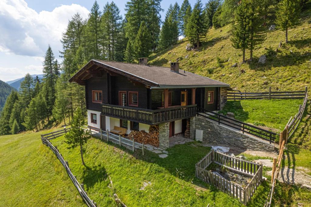 a small house on top of a hill at Almhütte Astental in Vordere Asten
