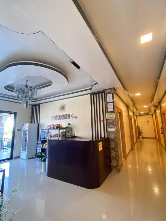 a lobby with a counter in the middle of a building at BICAMM Inn in Sampong