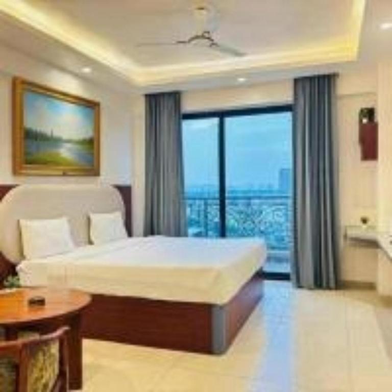 a hotel room with a bed and a large window at Hotel Four Season - Gomtinagar - Lucknow in Lucknow