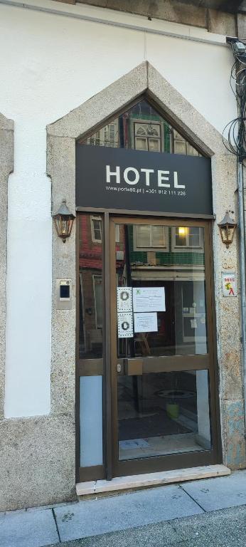 a hotel sign on the side of a building at Porta 80 House in Braga