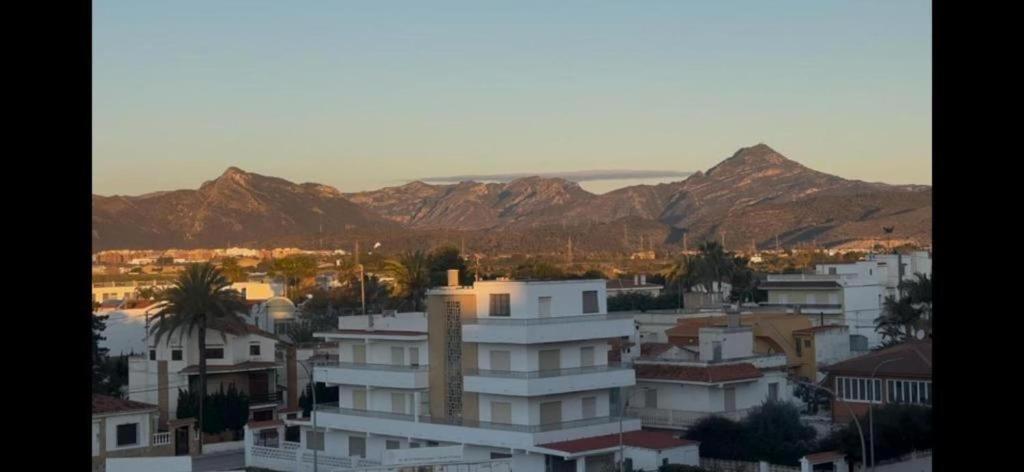 a view of a city with mountains in the background at Sea views-Balcony-Sleeps 6-Parking-AirCon Heating in Daimuz
