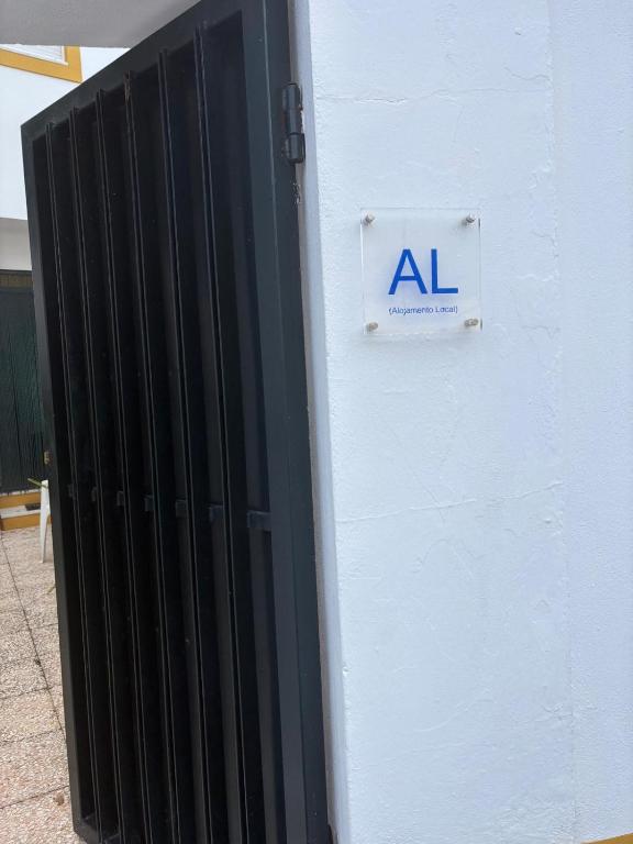 a sign on the side of a building at Casa da Avó Virgínia in Elvas