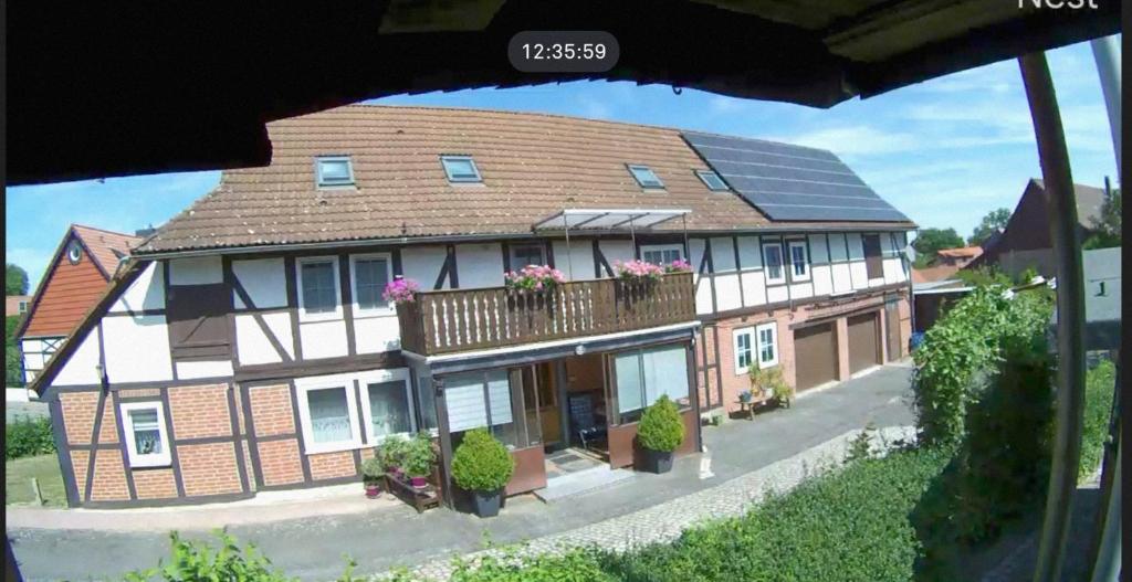 a rendering of a house with solar panels on it at FeWo Waldblick in Goslar