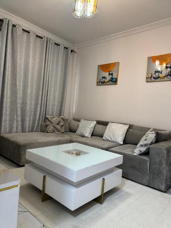 a living room with a couch and a coffee table at Luxx Homes #Unit A in Ruiru