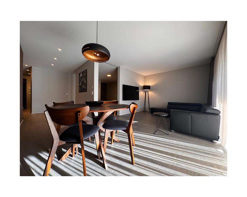 a dining room with a table and chairs at Zuhause am Bodensee in Bottighofen