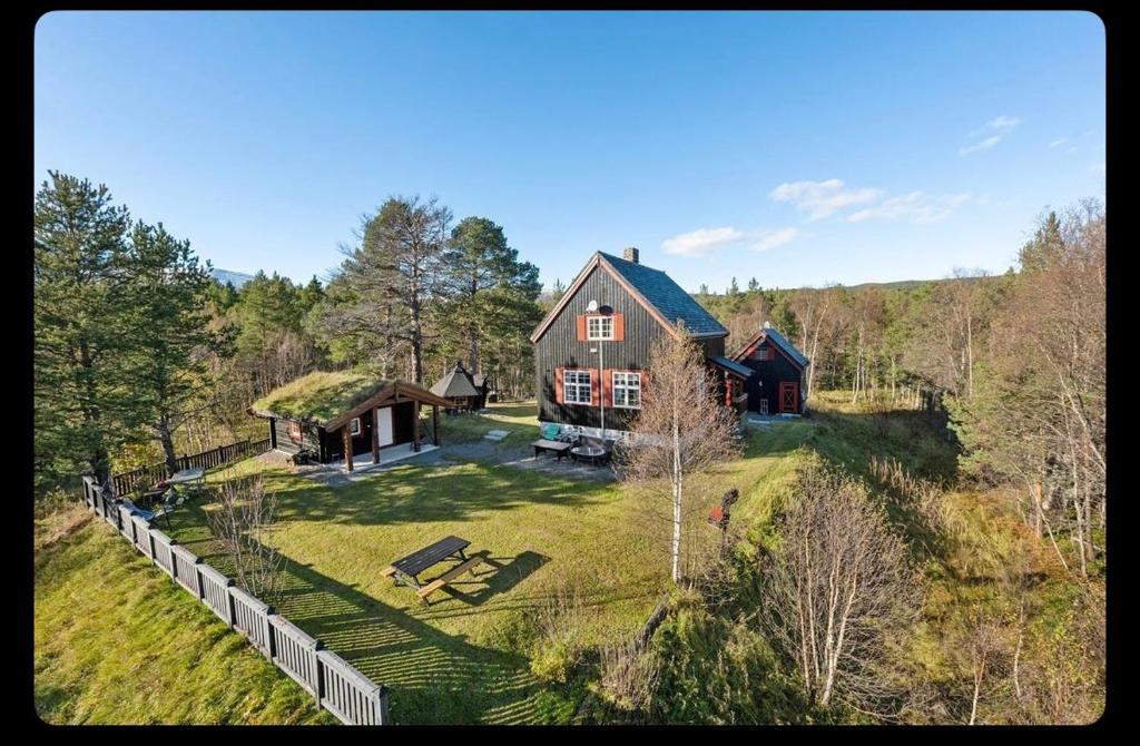an aerial view of a large house in the woods at Valhalla Hytte in Oppdal