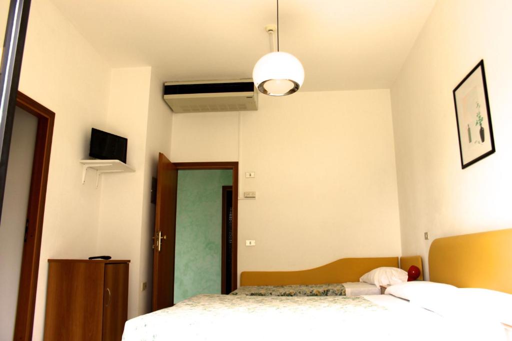 Postel nebo postele na pokoji v ubytování B&B Domus Mea