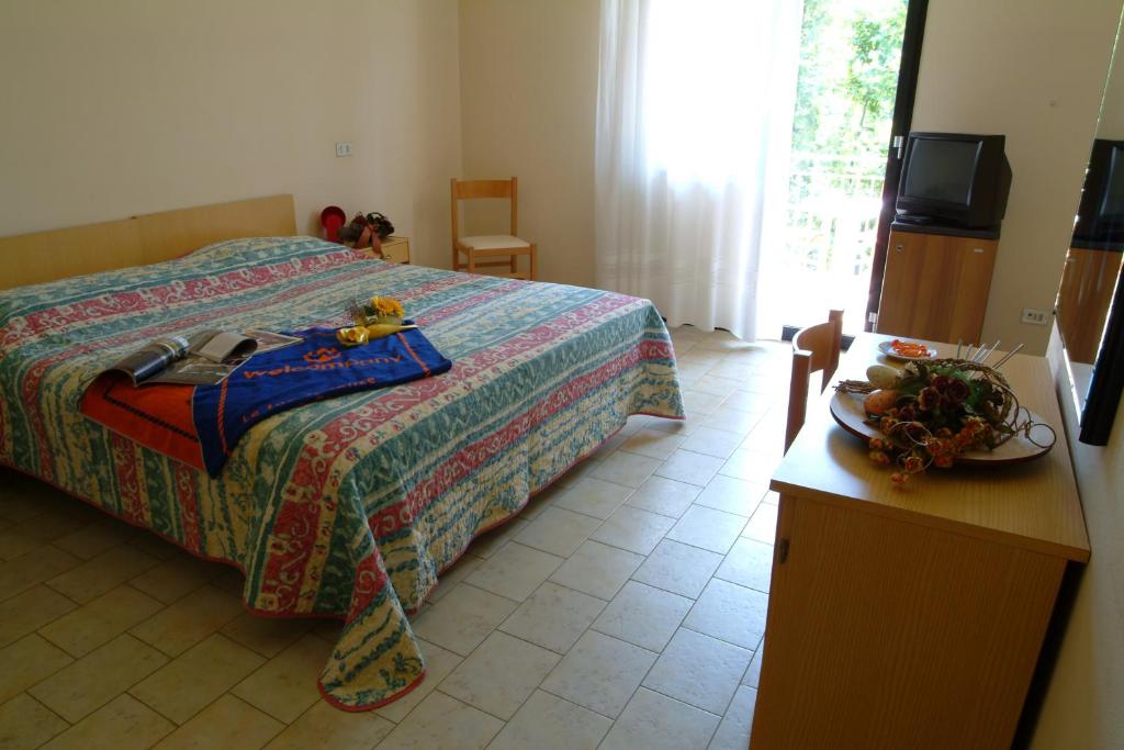 Postel nebo postele na pokoji v ubytování B&B Domus Mea