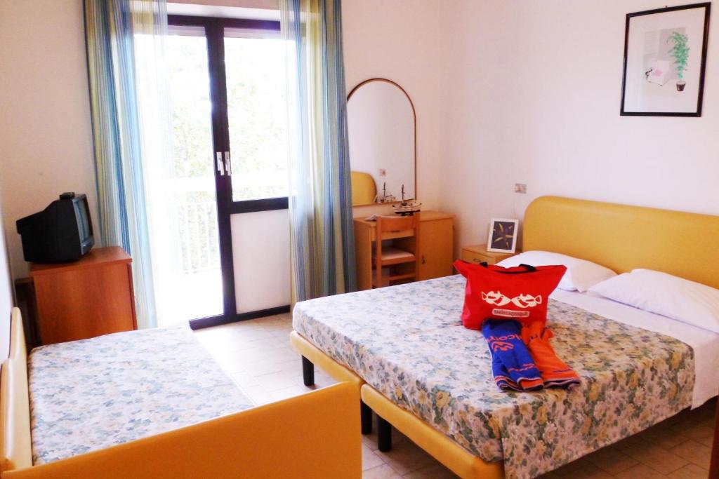 Postel nebo postele na pokoji v ubytování B&B Domus Mea