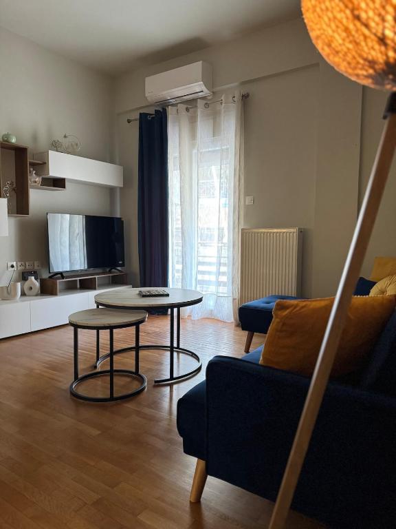 a living room with a couch and a table at Comfortable Family Apartment P3 in Larisa