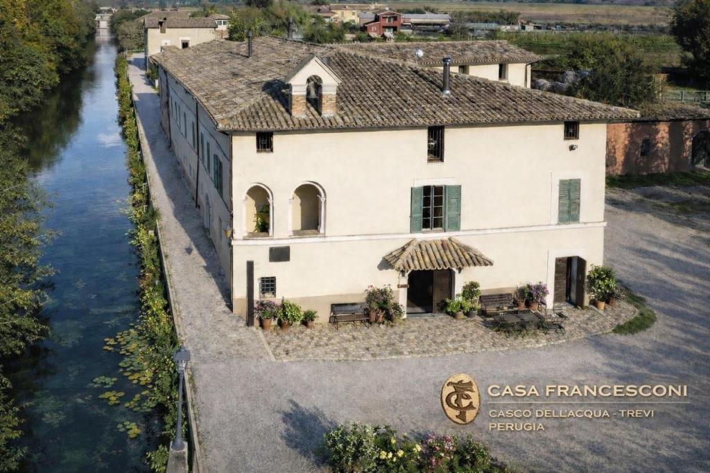 an aerial view of a house next to a river at Casa Francesconi in Pietra Rossa