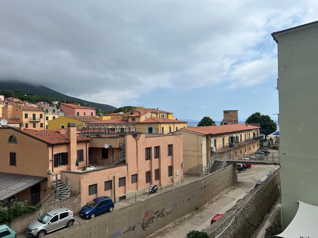 a view of a city with buildings and cars at Appartamento Giallo in Rio Marina