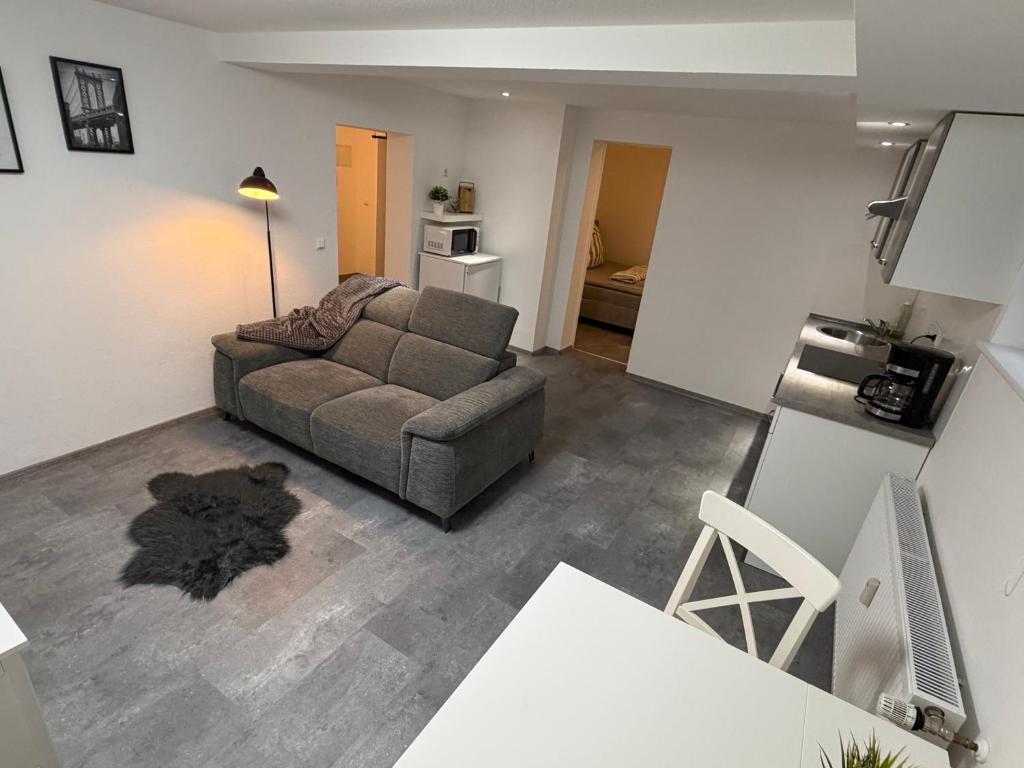 a living room with a couch and a table at Ferienwohnung Meister in Mayen