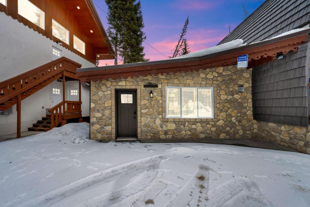 a house with snow in front of it at Alpenglow in Brighton