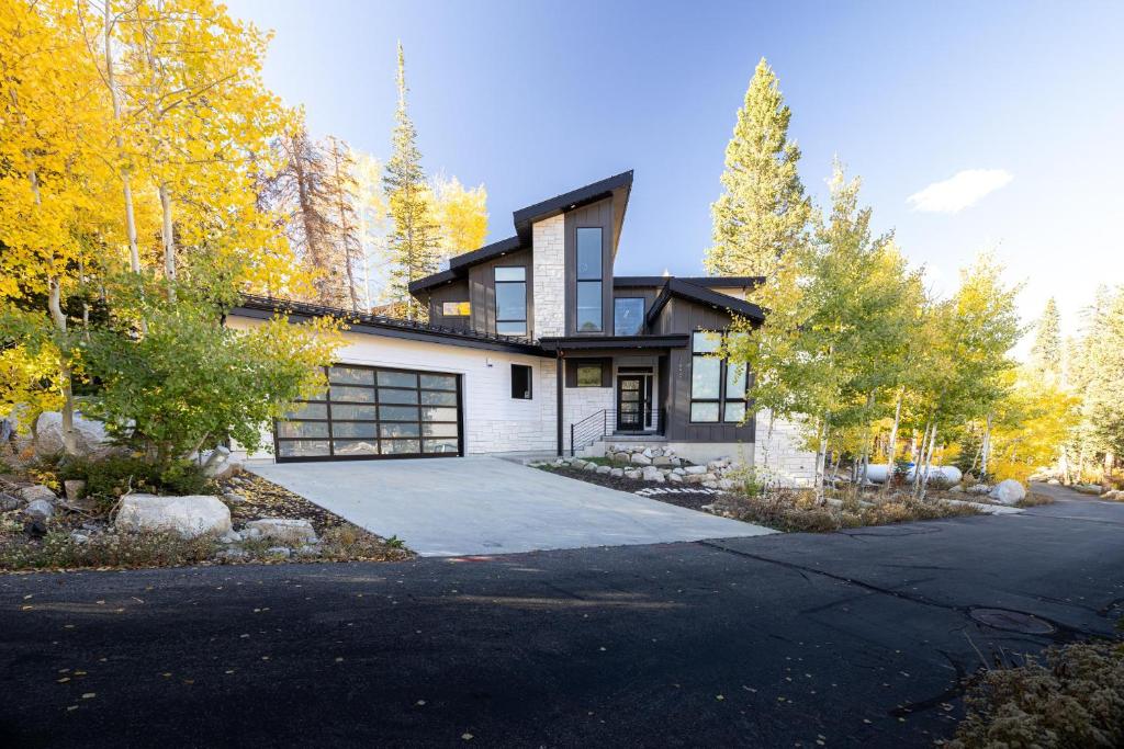 a house with a driveway and a garage at Milly 8752 in Brighton