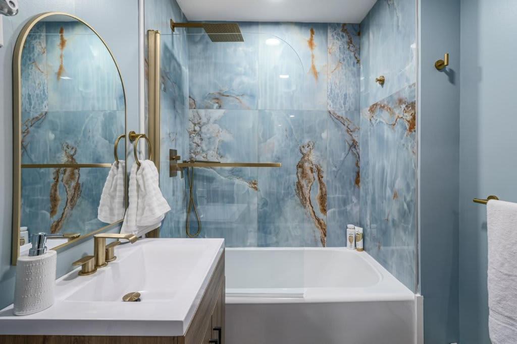 a bathroom with a sink and a mirror at Cozy Room in the City of Worcester in Worcester