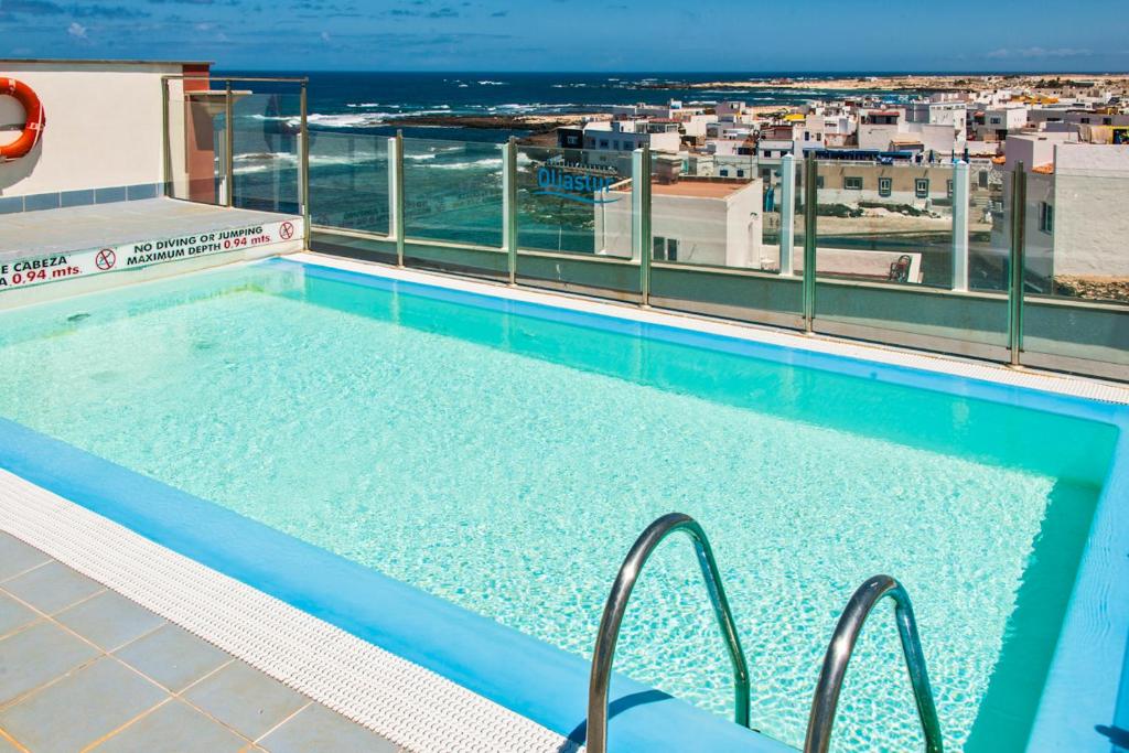 a swimming pool on the roof of a building at Casa Vista Mar Oliastur El Cotillo in El Cotillo