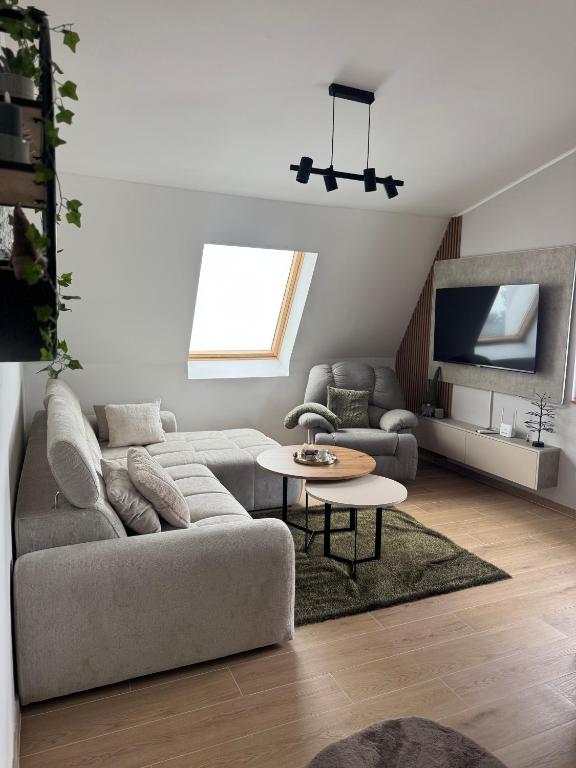 a living room with a couch and a table at Lunara Vlasic in Vlasic