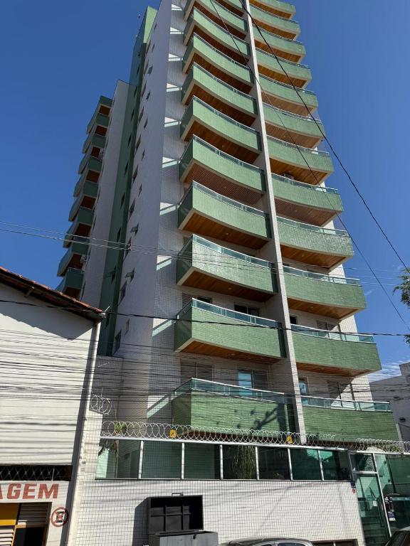 a tall building with balconies on the side of it at Flat Premium no Centro Tudo a Pé in Montes Claros