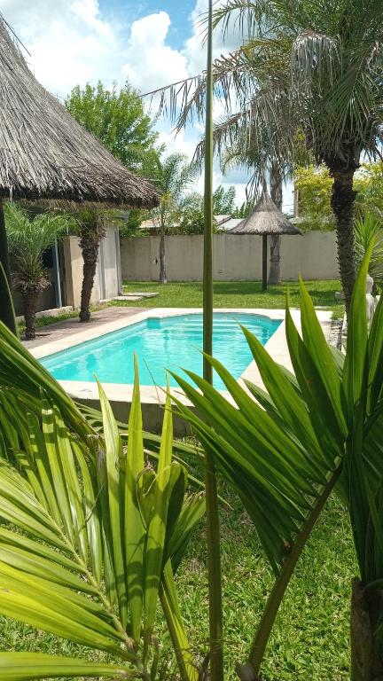 a swimming pool at a resort with plants at LaChula Casa con Piscina in Federación
