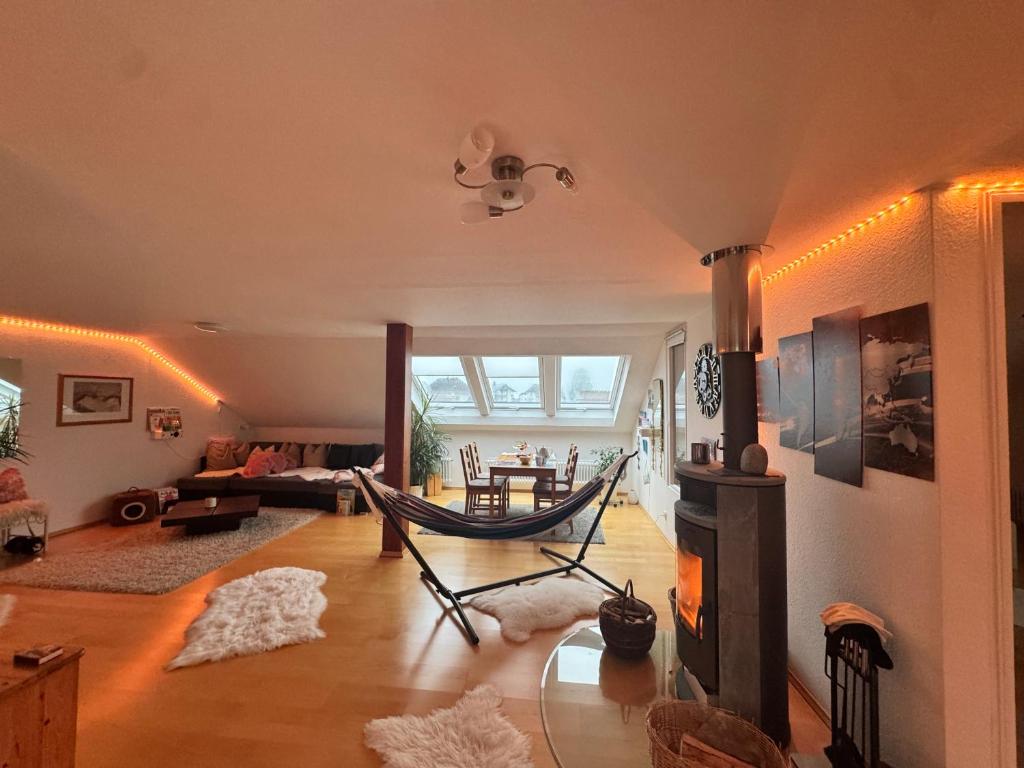 a living room with a hammock in a room at Gemütliche 3 Zimmerwohnung in Ühlingen-Birkendorf