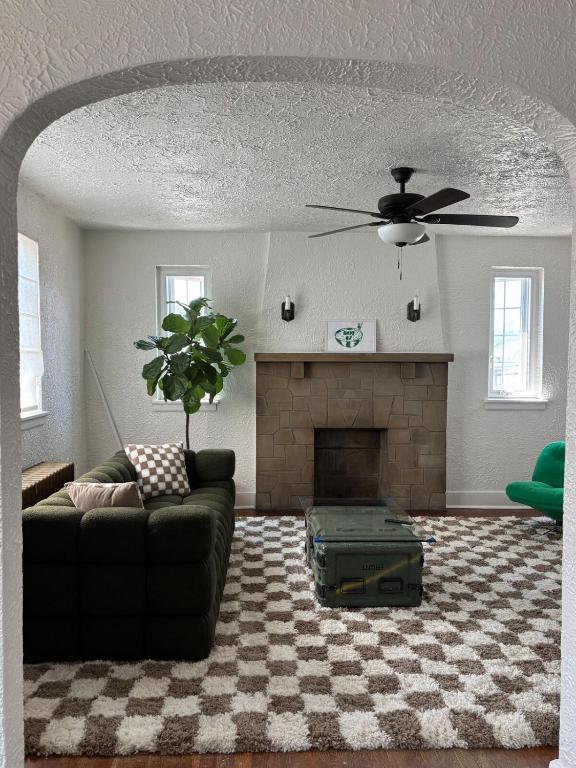 a living room with a couch and a fireplace at Pittsburgh Getaway - Private Home- 2 Beds in Pittsburgh