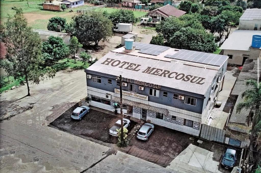 an aerial view of a hotel merocolis with parked cars at Hotel Mercosul in Butiá