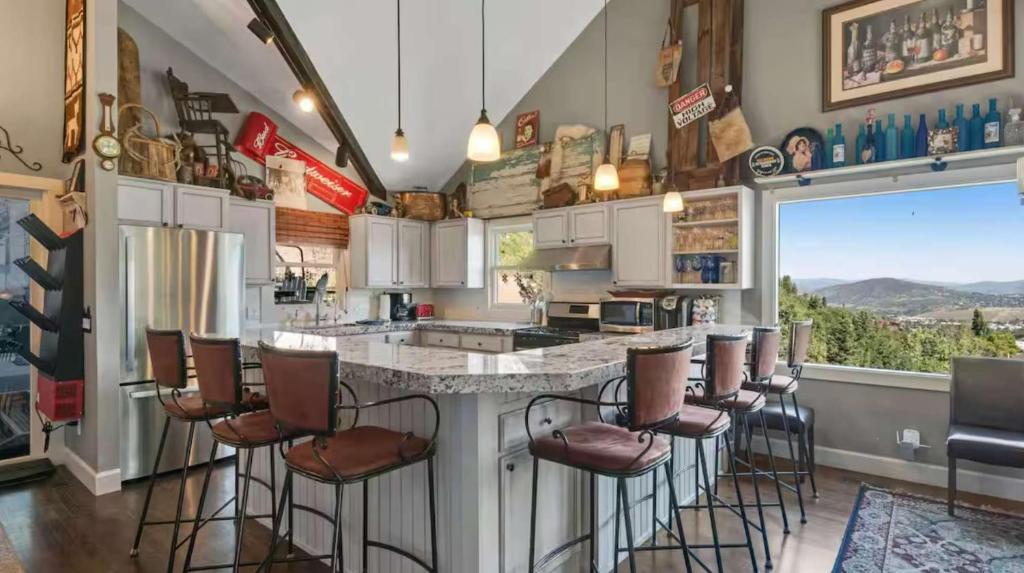 a kitchen with a large island with bar stools at Ridge Home Multi-level with PC Views Ski Trail in Park City