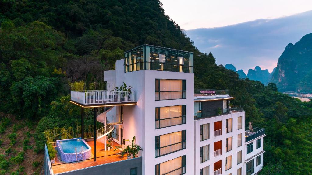 a building with a view of a mountain at Yangshuo MUSE Mountain View Retreat in Guilin