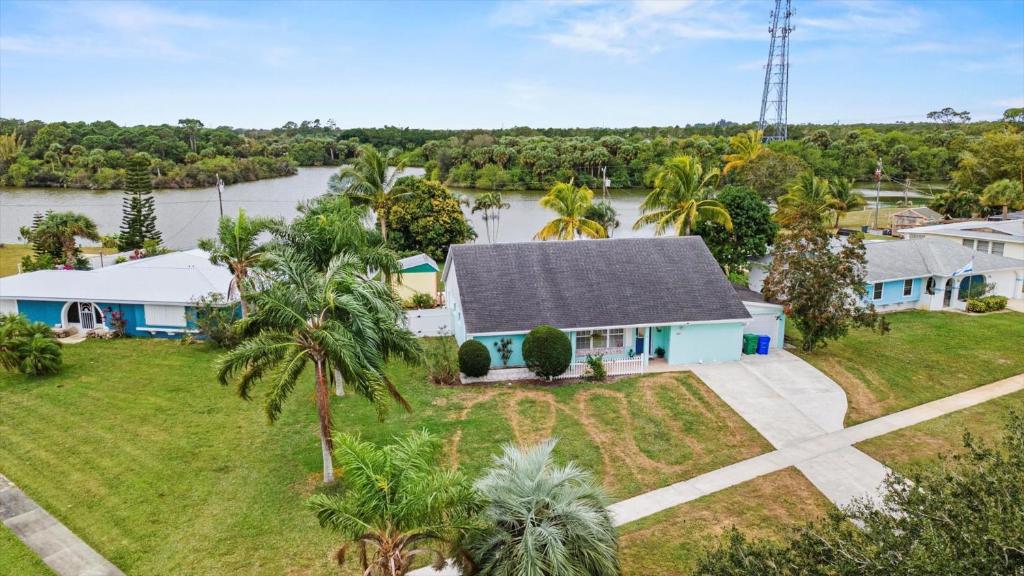 an aerial view of a house with a river in the background at Lakehouse Sunsets in Sebastian