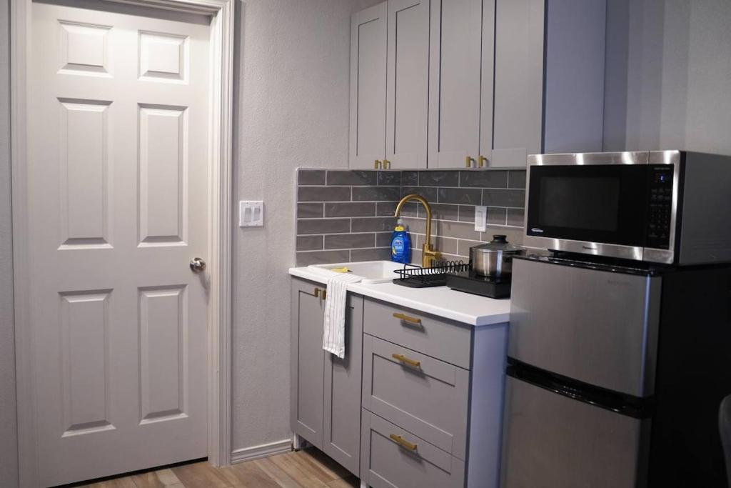 a kitchen with a sink and a microwave at Studio in North Bend in North Bend