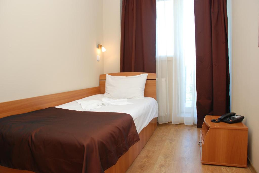 Postel nebo postele na pokoji v ubytování Hotel Liliacul