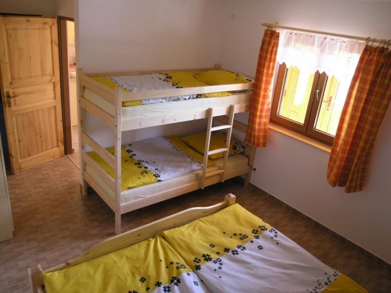 Postel nebo postele na pokoji v ubytování Chaty u Tesaru