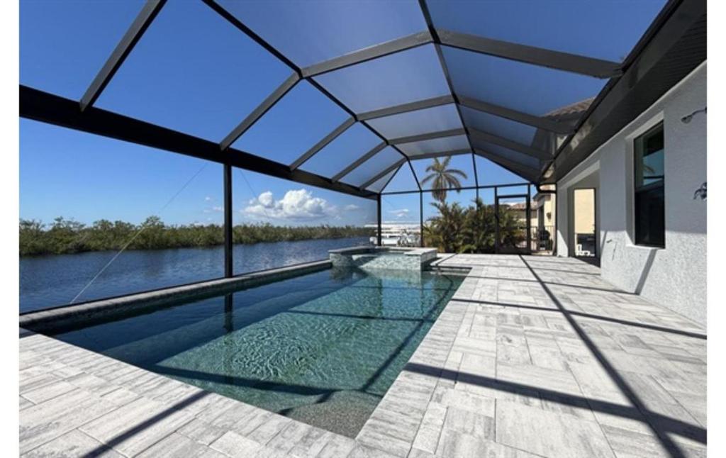 an image of a house with a swimming pool at Sandi Villa in Cape Coral