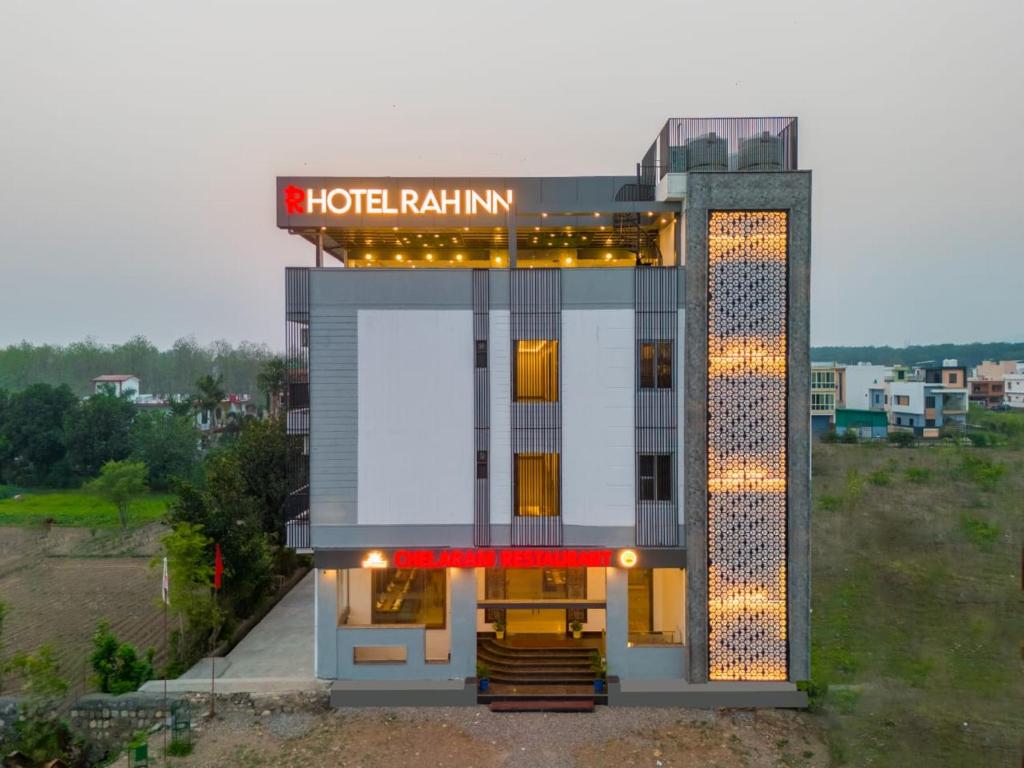 a building with a hotel rating sign on top of it at HOTEL RAH INN - Yog Nagari Rishikesh Railway Station in Rishīkesh