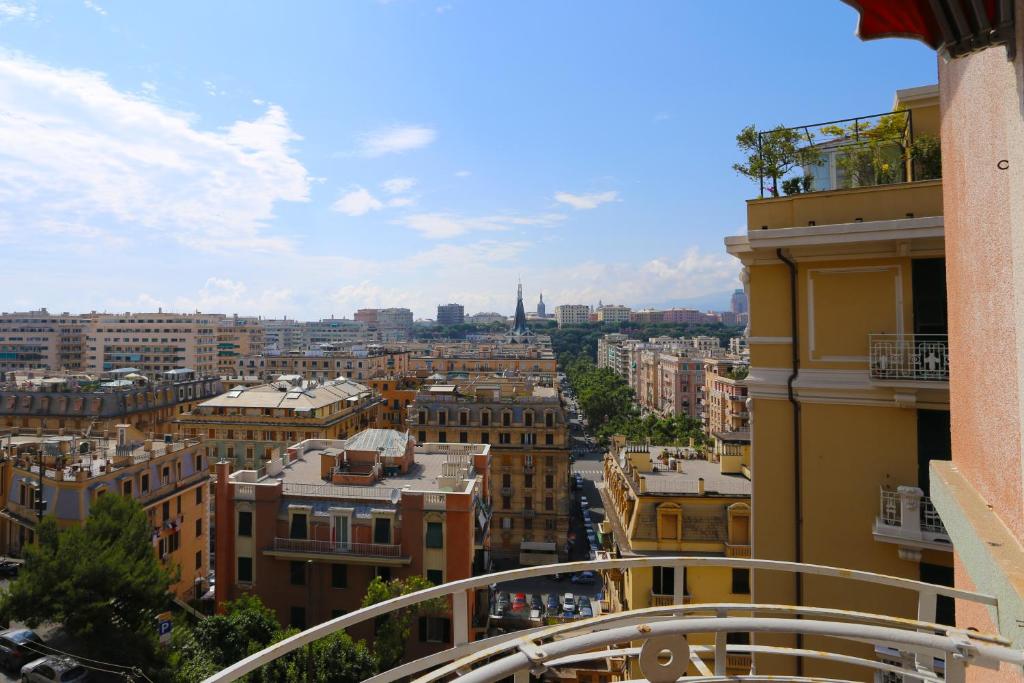 a view of the city from the balcony of a building at Decana Flexyrent Apartment in Genova