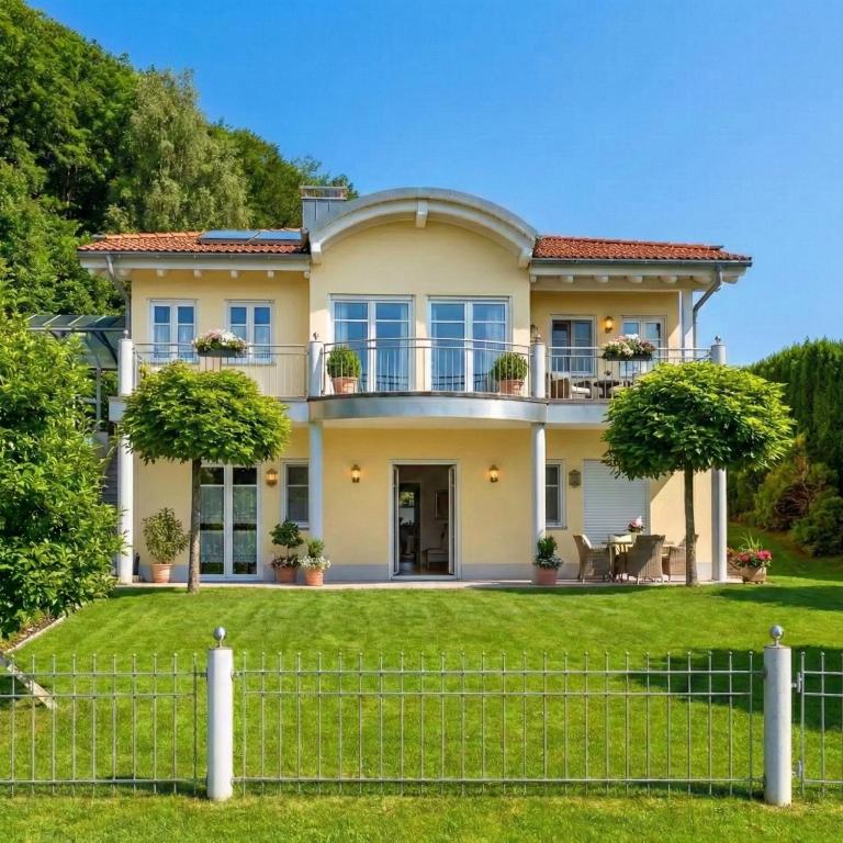 a house with a fence in front of it at Bergperle am Lindberg in Perlesreut