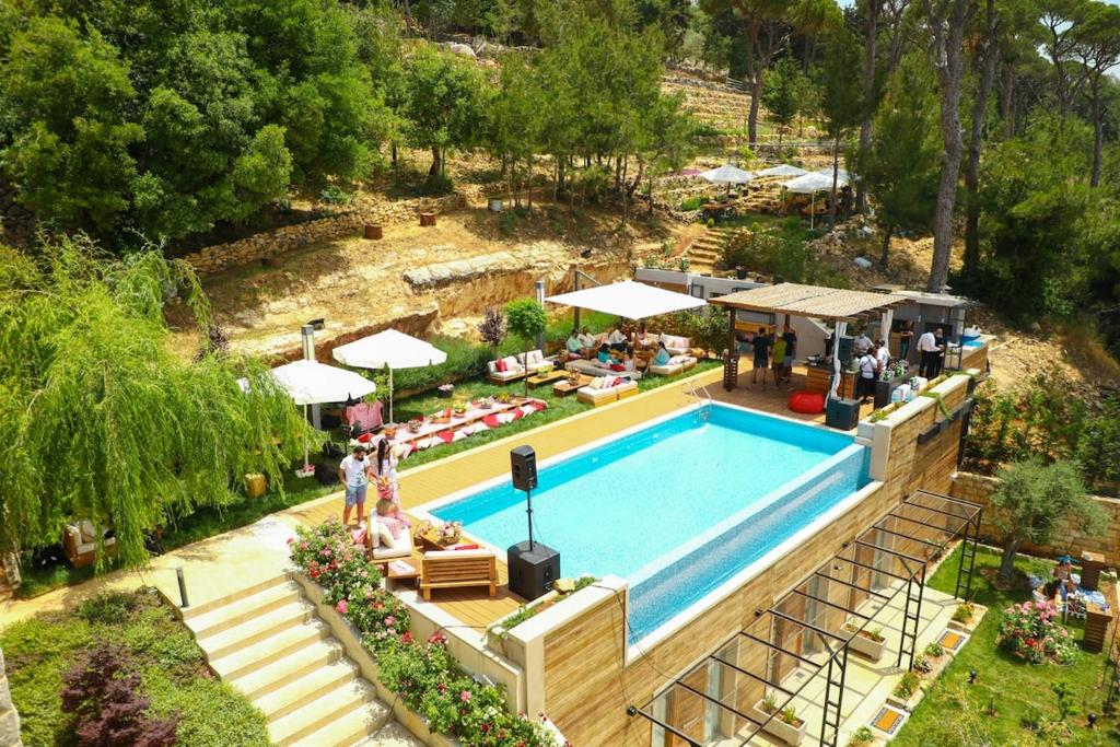 an overhead view of a swimming pool at a resort at Beit Colette in Beït ed Dîne