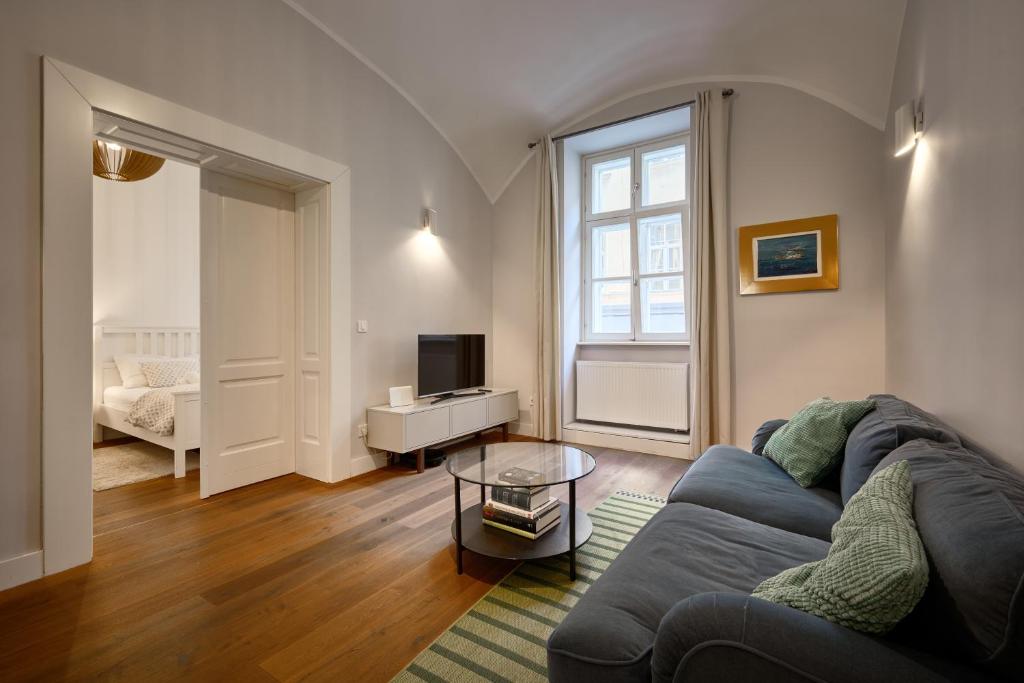 a living room with a couch and a tv at Deluxe Apartment Talia by Irundo in Zagreb