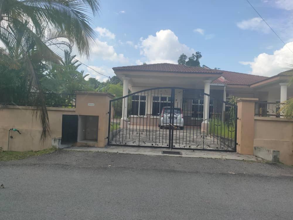 a house with a gate in front of it at SemiD in Batu Kikir