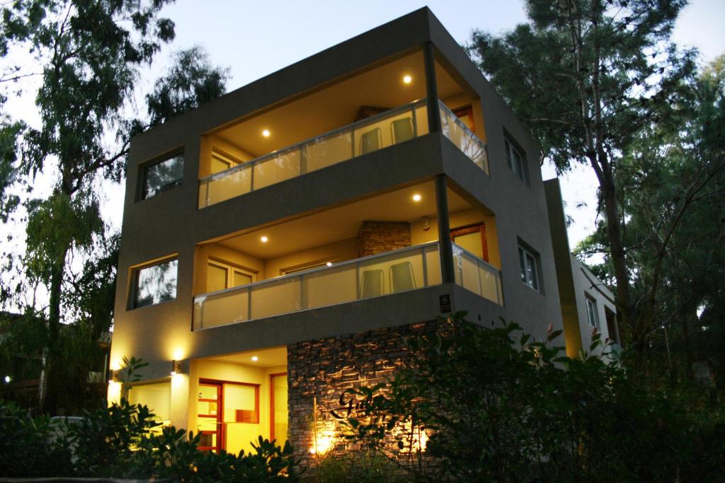 a large house with balconies on the side of it at Gala Apart Boutique & Spa -sólo para adultos- in Mar de las Pampas