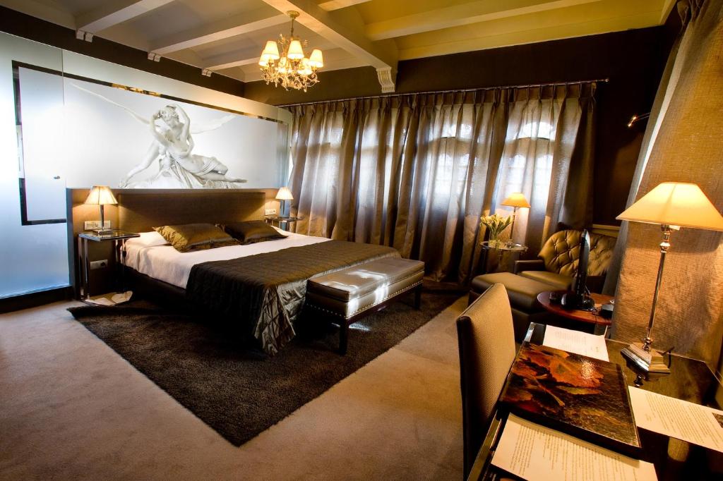 Cama o camas de una habitación en Hotel Castillo El Collado
