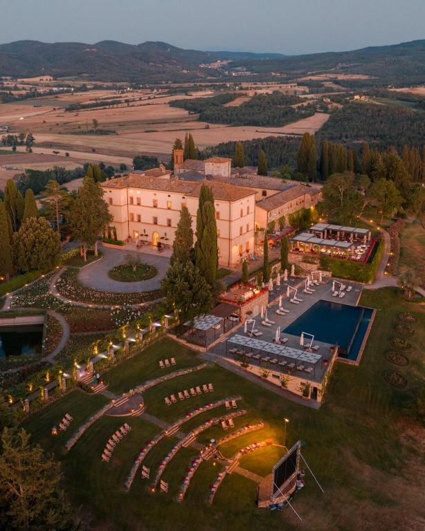 an aerial view of a building with a pool at Castello di Casole, A Belmond Hotel, Tuscany in Casole dʼElsa