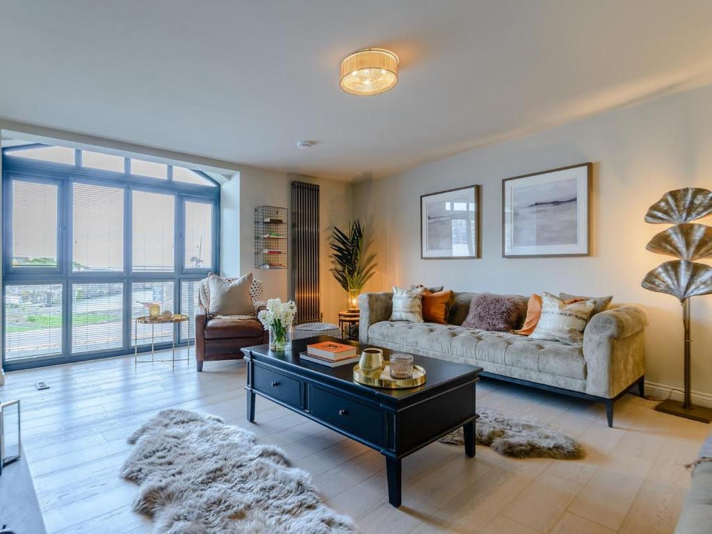 a living room with a couch and a coffee table at 3 Bed in Alnwick oc-77571 in Craster