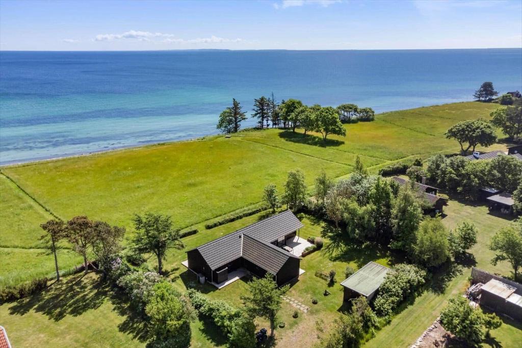 an aerial view of a house on a hill near the ocean at 20422-Samso-Egernvej-16 in Ballen