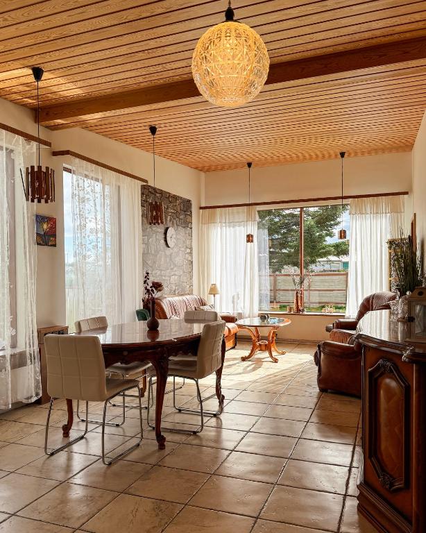 a living room with a table and chairs and a couch at BSG Apartments in Selfoss