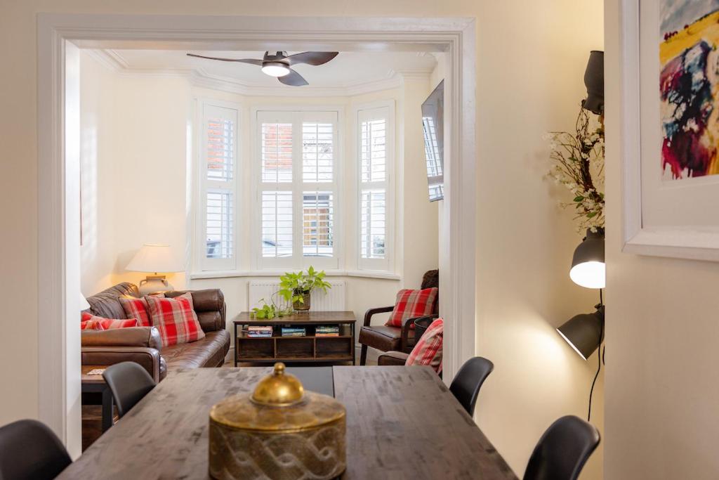 a living room with a table and a couch at Trevor Street in Holywood
