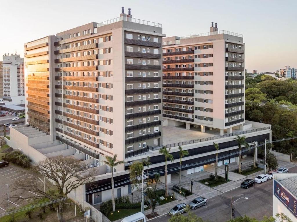 an overhead view of two tall buildings in a city at LOFT1304 Maxplaza Canoas in Canoas